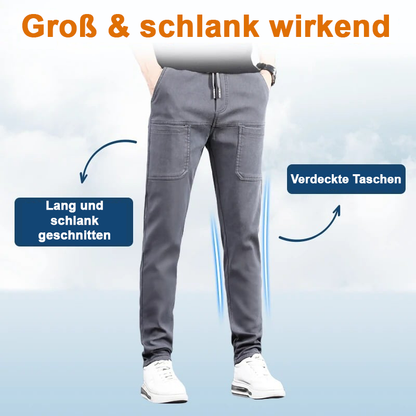 Grey trousers on a model with arrows pointing to the slim cut and concealed pockets 19