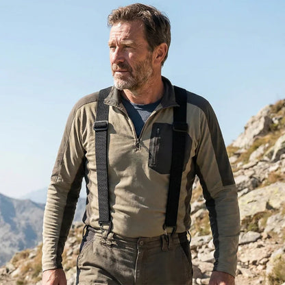Bearded man on a mountain trail wearing black braces over a khaki fleece top 16