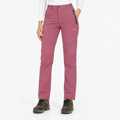 Front view of the trousers in a dusky rose pink with zipped pockets 17