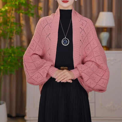 Model wearing the open knit shawl cardigan in dusty pink with a ribbed shawl collar and cuffs 10