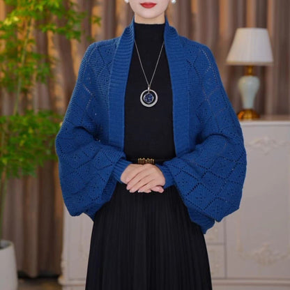 Model wearing the open knit shawl cardigan in deep royal blue with full lantern sleeves 9