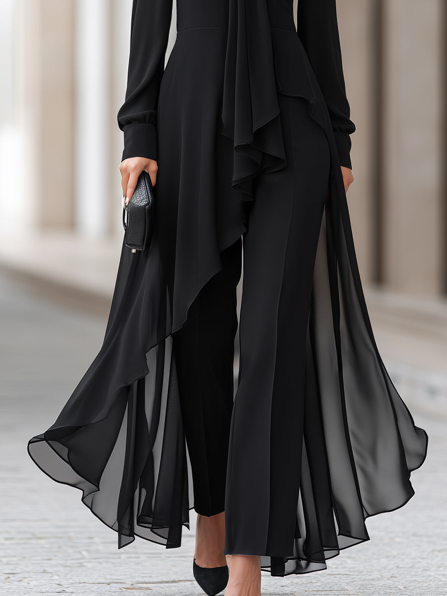 Lower half of the outfit showing the sheer asymmetric chiffon hem flowing over black wide-leg trousers 4