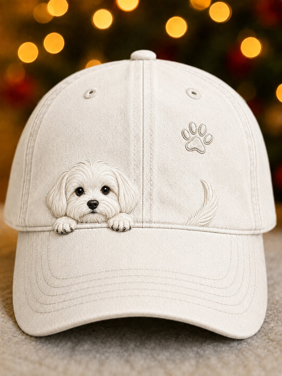 Front view of the cream cap with a peeking white puppy, paw print and tail motif 1