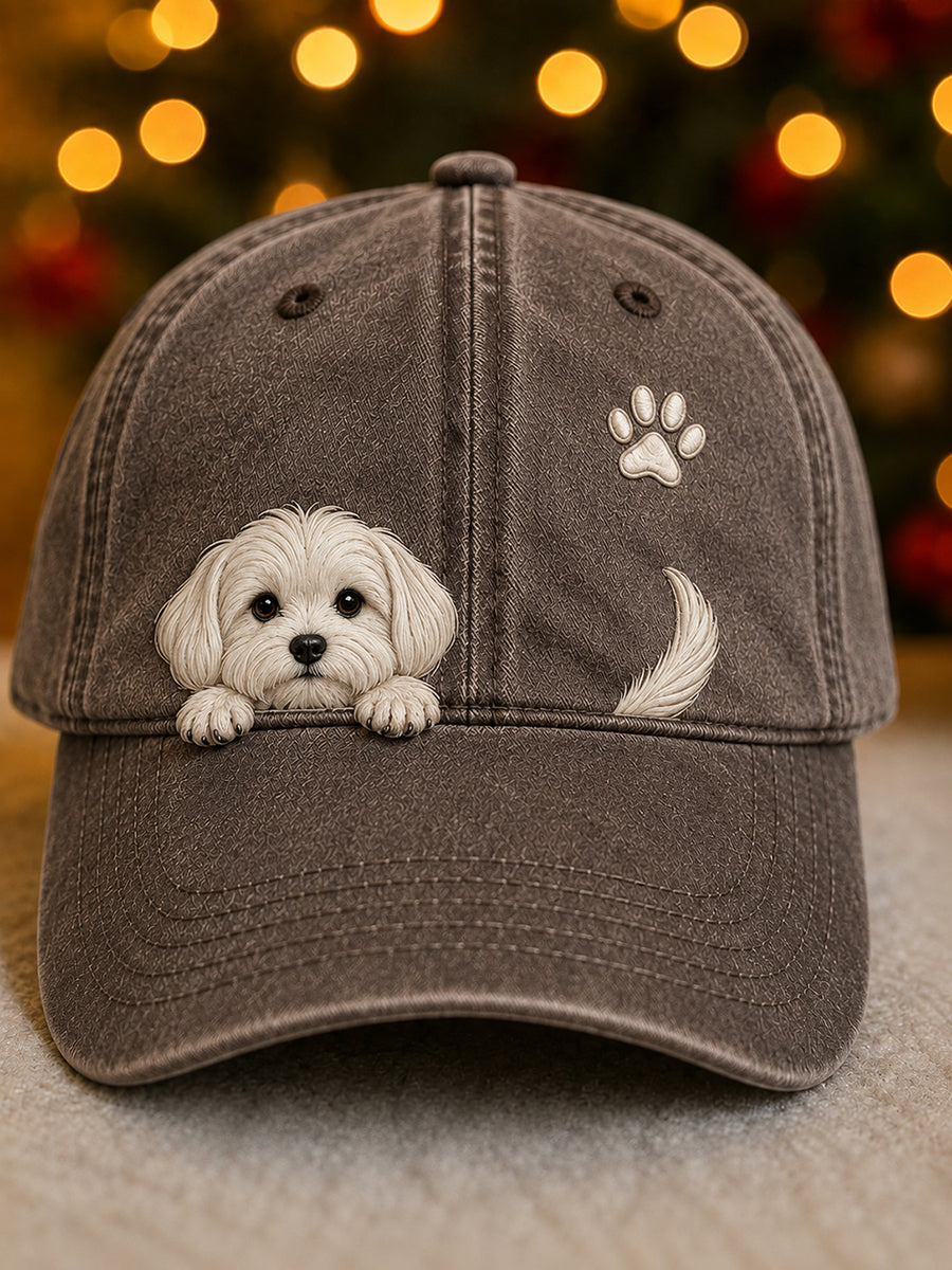 Front view of the brown washed cap with a peeking white puppy, paw print and tail 6