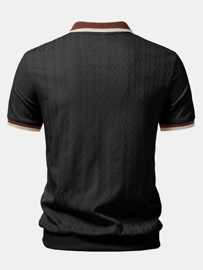Back view of the black polo, showing the ribbed hem, tonal cable texture and contrast collar trim. 4
