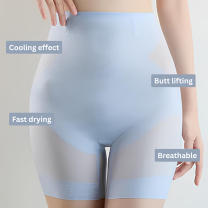 Front view on a model of translucent light blue high-waisted shorts with banded leg hems and a hand resting on the hip. 4