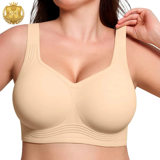 Close-up front view of the beige wireless bra worn by a model, one hand lifting a wide strap 1