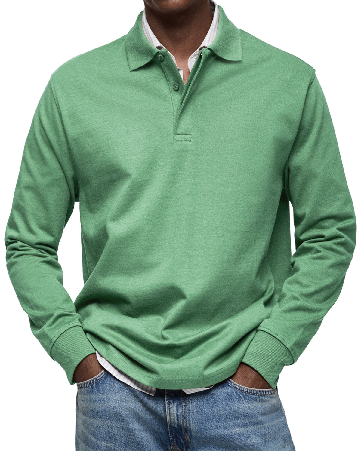 Green version worn by a model, layered over a striped shirt with light jeans 7