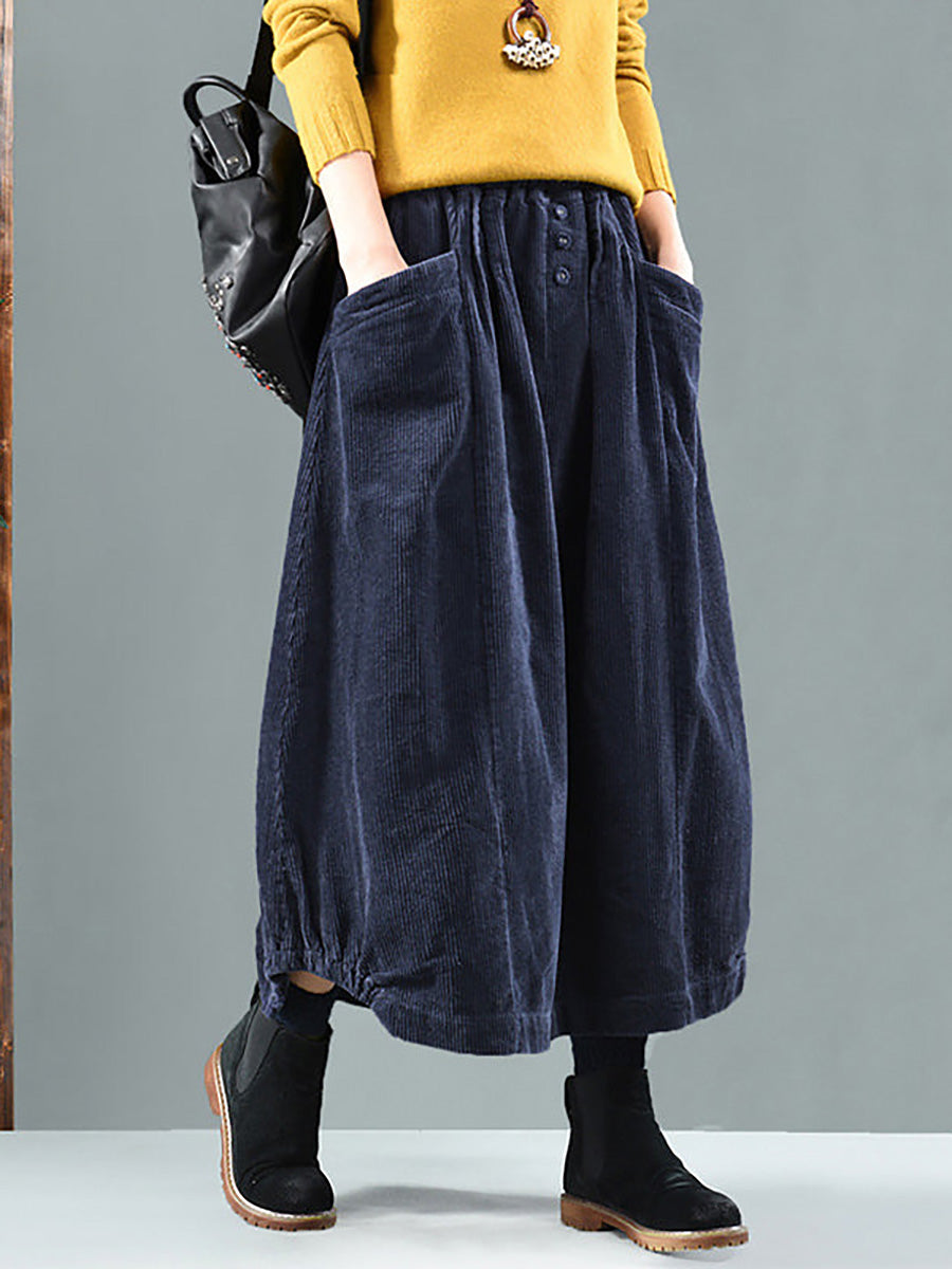 Navy corduroy version worn with a mustard jumper, showing wide patch pockets and three buttons 4