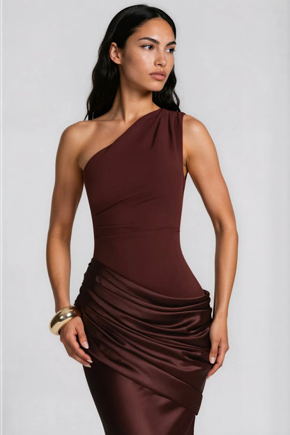 Close-up of the brown gown's bodice and draped satin waist, worn with a gold cuff 9