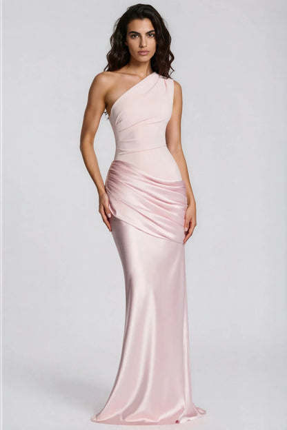 Soft pink version of the dress on a model, front view with wavy dark hair 30