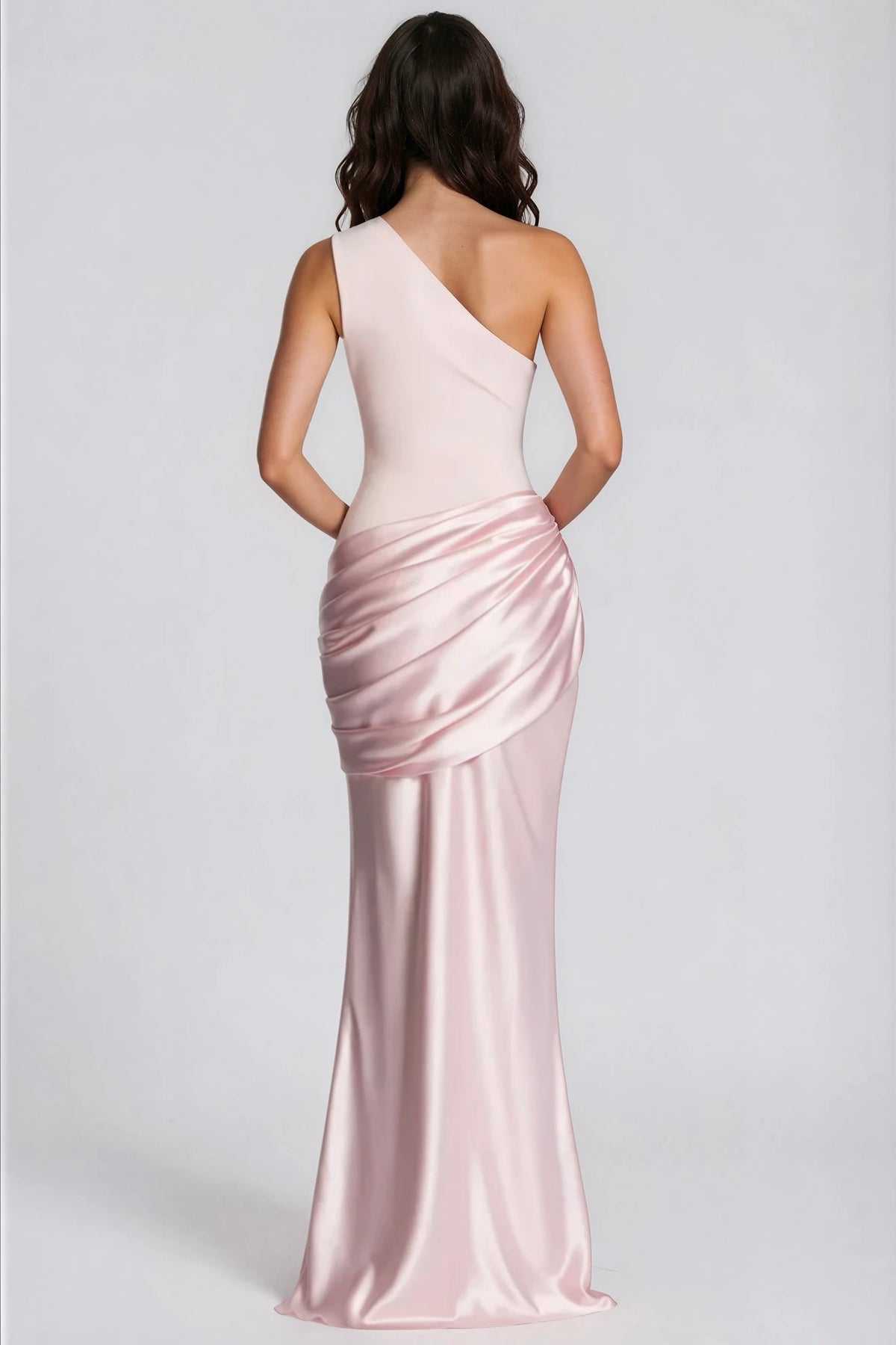 Back view of the pale pink one-shoulder dress, showing the draped satin hip detail 31