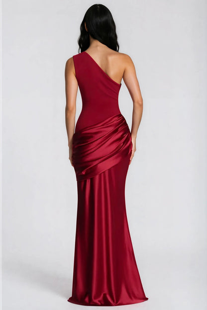 Back view of the deep red dress, showing the one-shoulder cut and draped satin hip panel 35