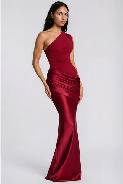 Angled view of the deep red dress, showing the fitted bodice and glossy flared skirt 36