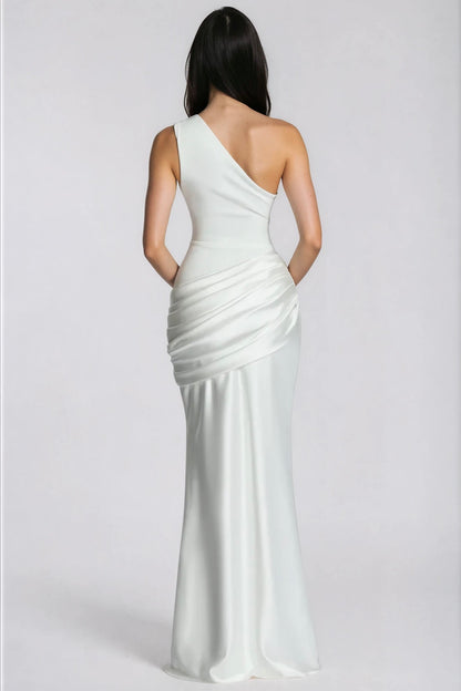 White gown from behind, showing the one-shoulder strap and gathered satin drape at the hip 10