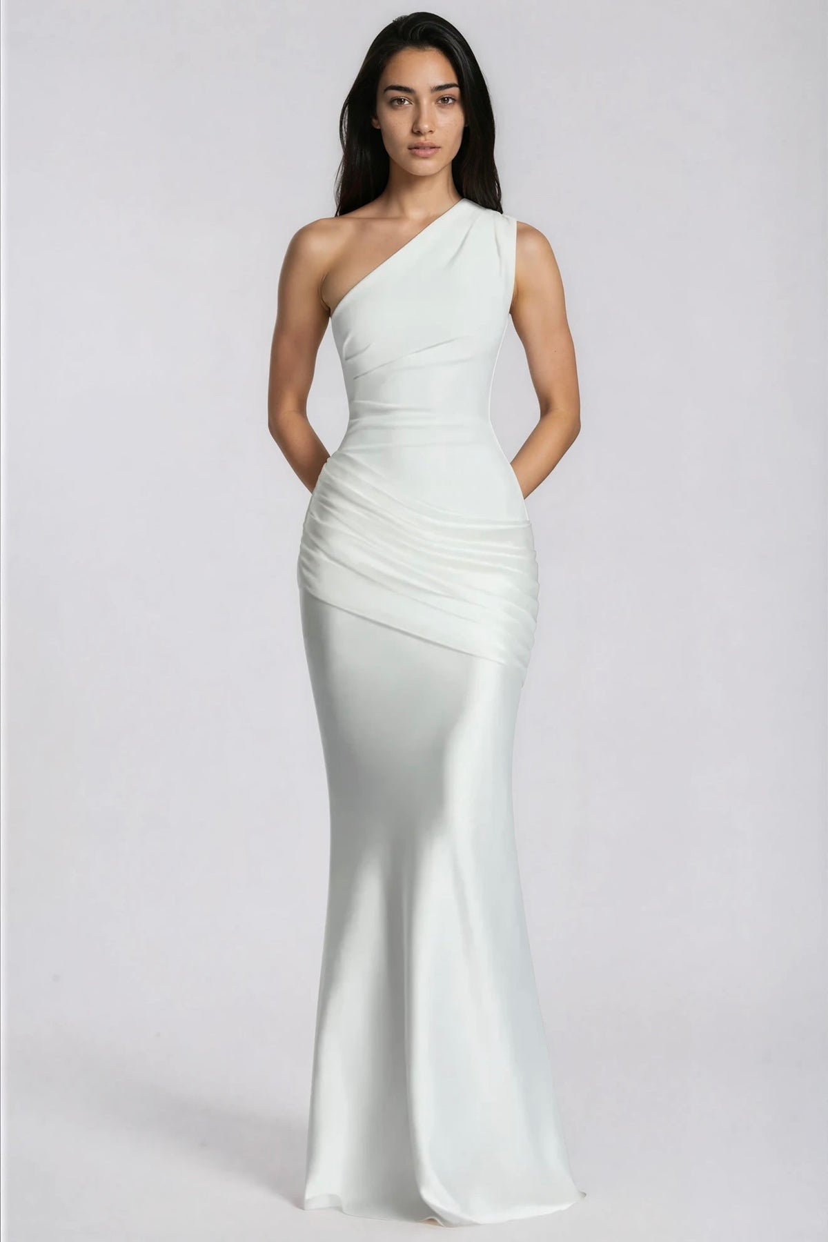 White one-shoulder satin gown from the front, with arms behind the back 12