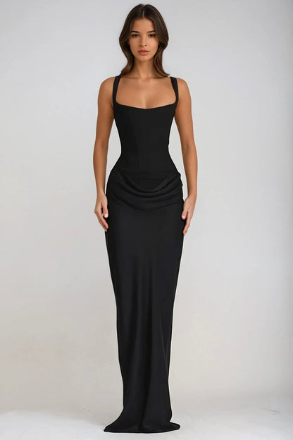Front view of the black maxi dress on a model, with square neckline and fitted floor-length skirt 28