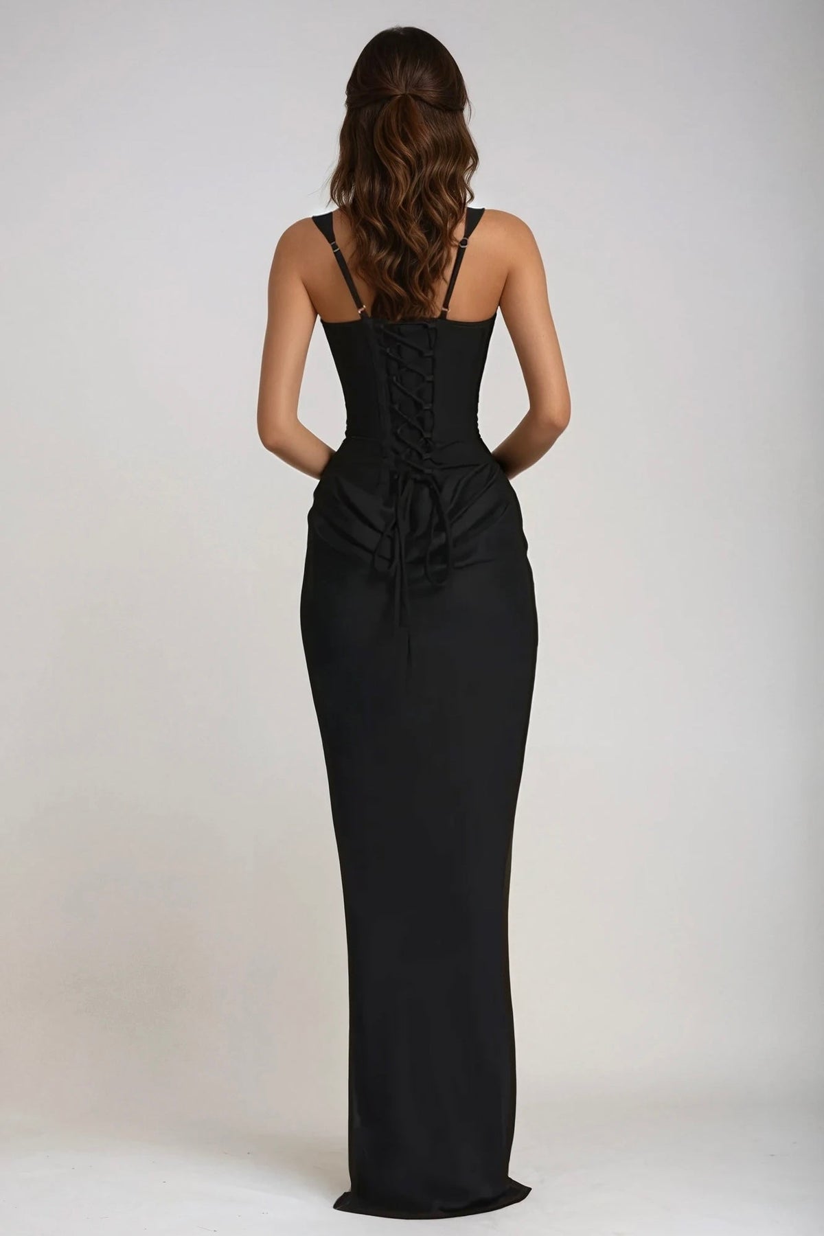 Back view of the black dress, showing the lace-up corset back, adjustable straps and gathered detail at the waist 27