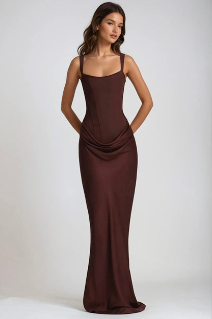 Model in the brown maxi dress with hands behind her back, showing the full-length fitted silhouette 8