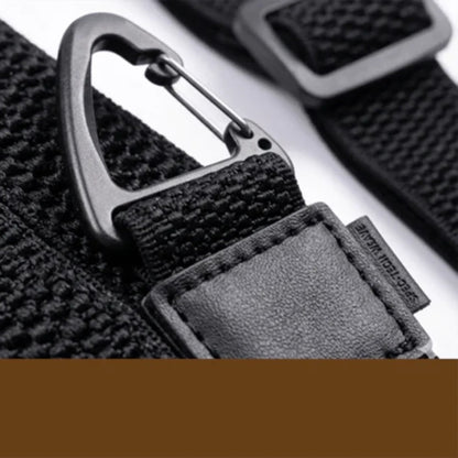 Close-up of a black woven strap end with a metal clip, stitched leather-look tab and slide adjuster 14