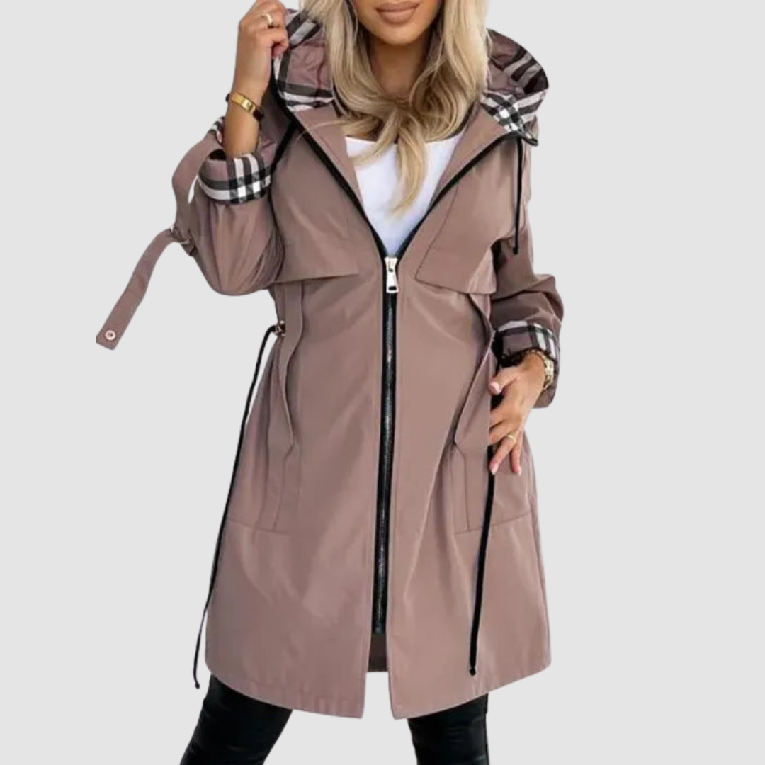 Model wearing the mocha-brown hooded coat unzipped over a white top, showing the checked hood lining, cuffs and waist drawstrings. 1