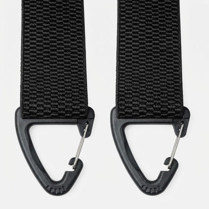 Close-up of two black triangular plastic clip hooks with metal gates at the strap ends 7