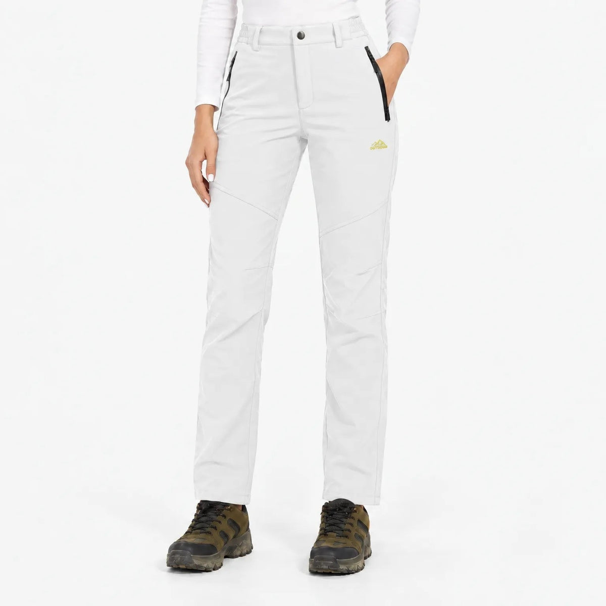 Front view of the trousers in white, shown with brown hiking boots 15