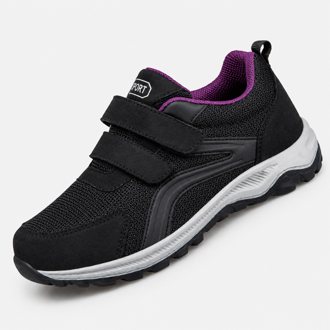 Single black strap shoe with purple interior lining and grey sole, angled view on white 8