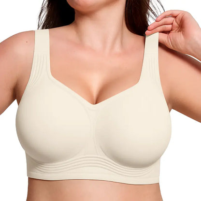 Cream bra with wide straps and ribbed side detailing, worn by a model touching one strap 6