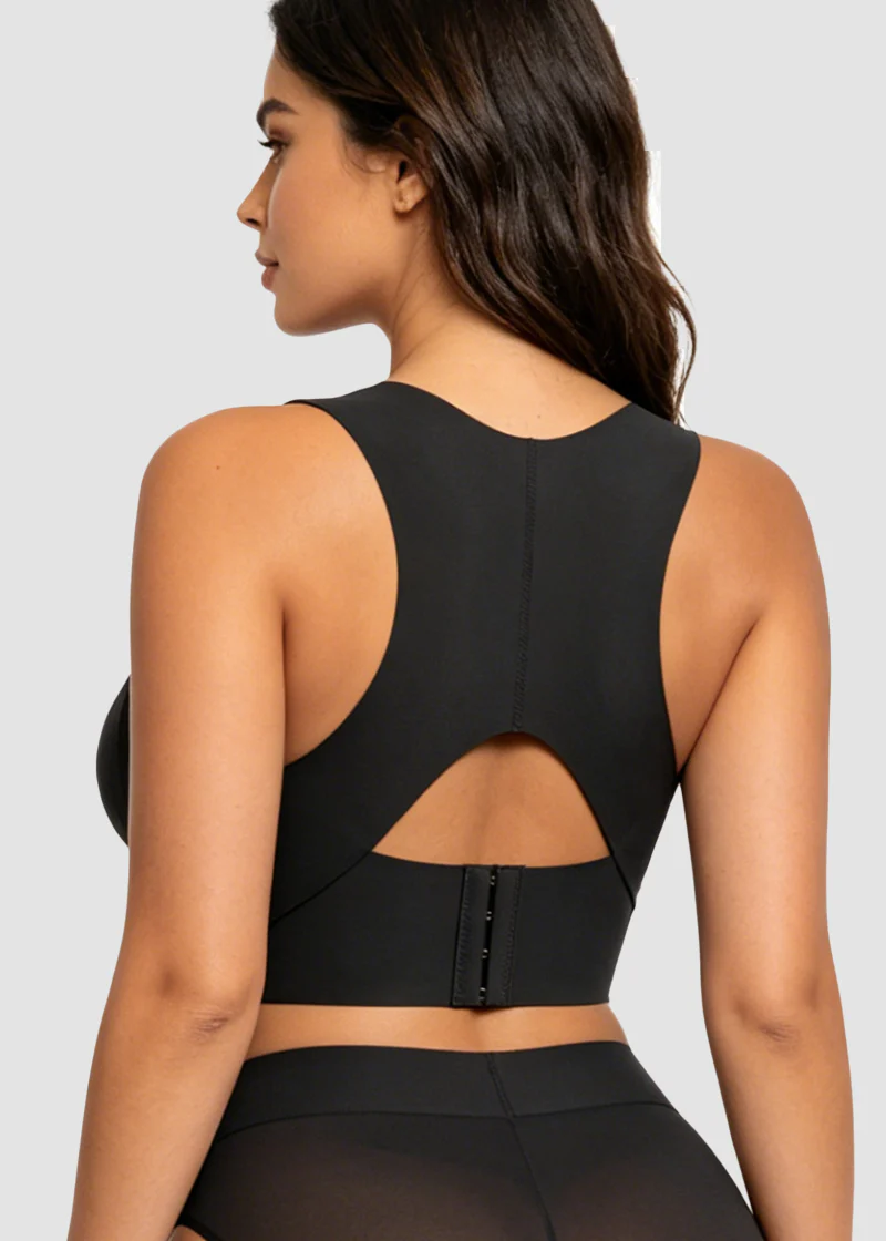 Back view of the black bra on a model, showing the racerback with keyhole cut-out and hooks 16