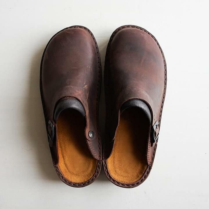 Top-down view of dark brown leather clogs showing the tan suede footbeds and stitched edges 7
