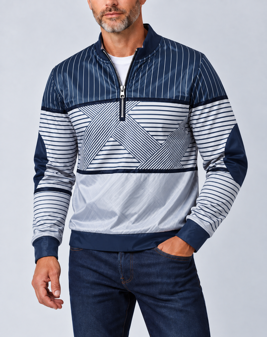 Bearded man wearing the navy and white striped half-zip jumper with dark jeans, hand in pocket 1