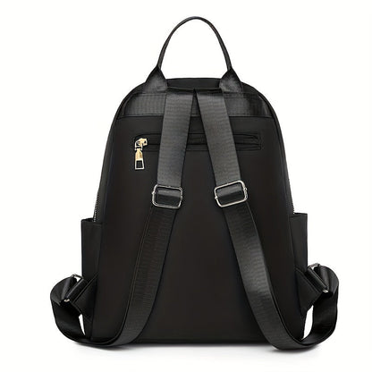 Back of the black backpack showing the adjustable padded shoulder straps, top handle and zipped hidden pocket 7
