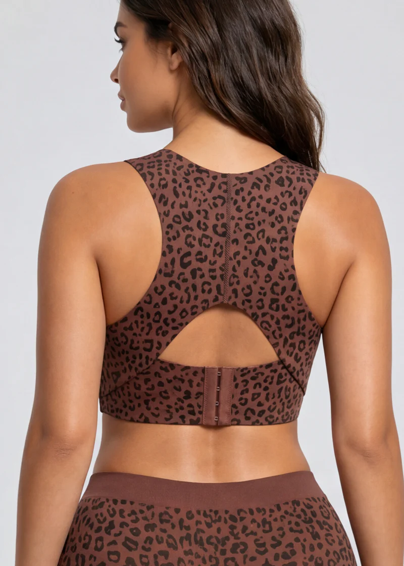 Back view of the brown leopard-print bra on a model, showing the keyhole cut-out and hook closure 11