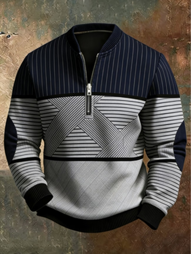 Front view of the half-zip sweater in navy and light grey with black ribbed cuffs 1