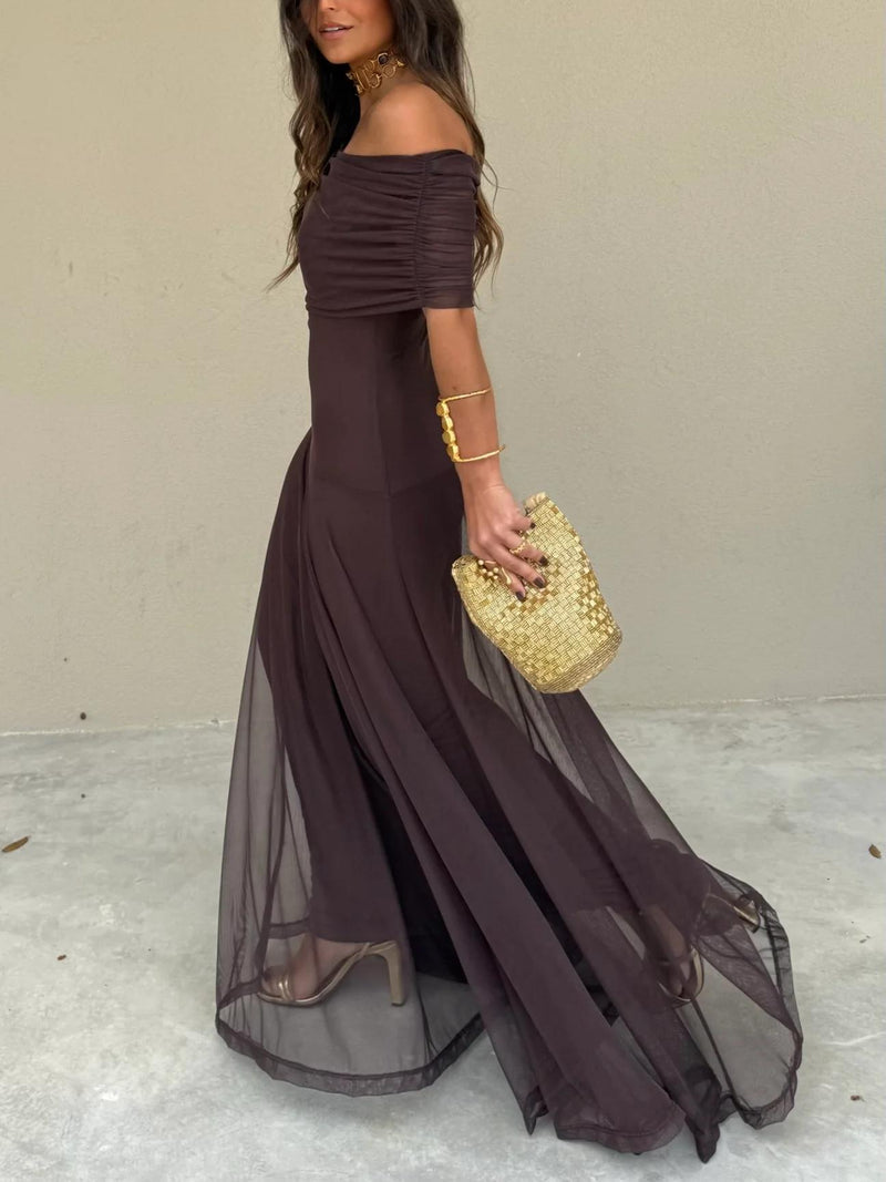 Side view of dark brown sheer mesh overlay skirt flowing over a fitted underdress 13