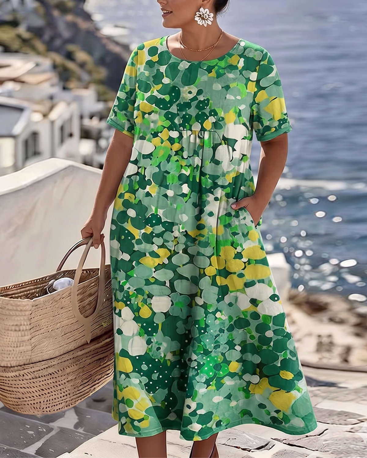 Green and yellow floral dress on a second model, hand in pocket, showing the loose flowing fit 6