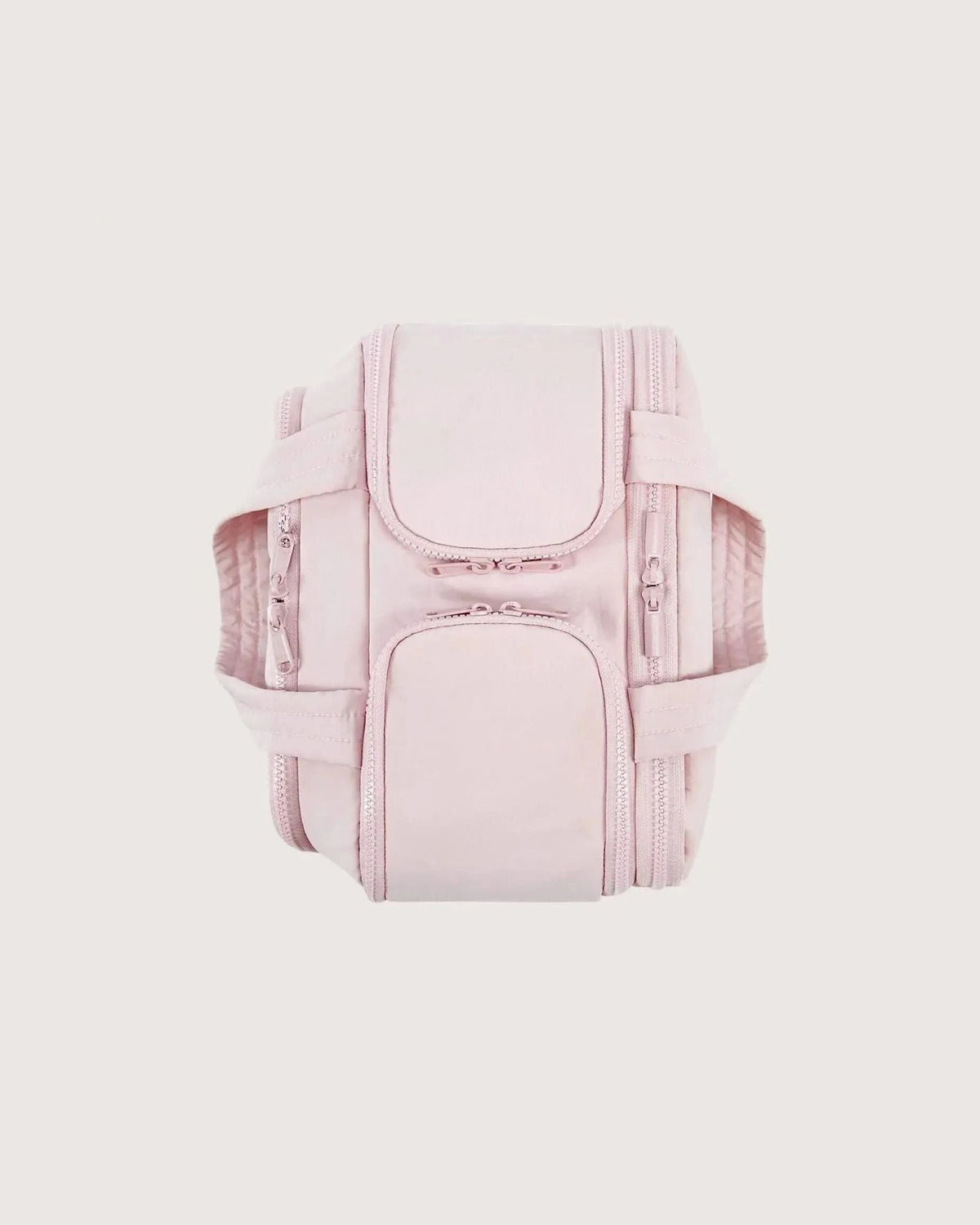 Pink bag seen from above on a plain background, showing its zipped compartments and padded handles folded down on either side. 9