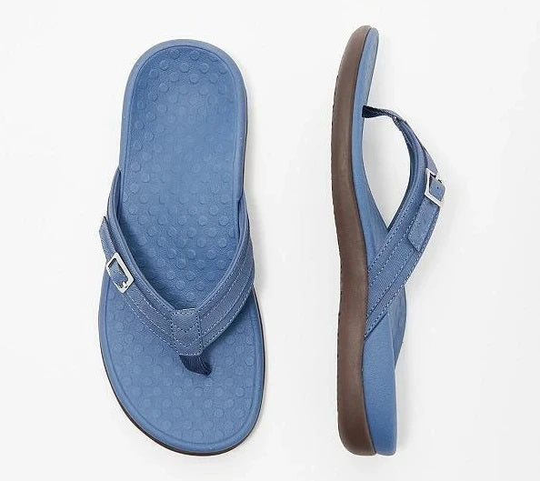 Flat lay of a blue thong sandal from above and the side, dotted textured footbed 7