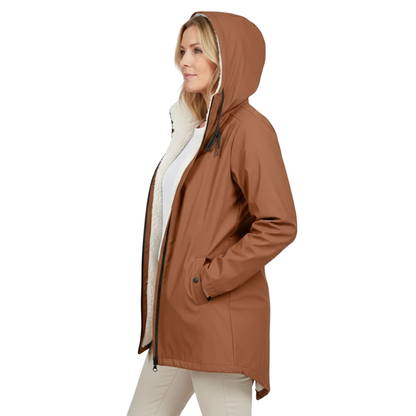 Side view of a model wearing the tan-brown jacket open, hood up, showing the cream fleece lining and a hand in the pocket. 2