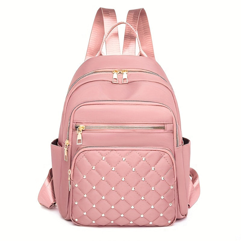 Pink backpack front view with a quilted, gold-studded front pocket and gold zips 12