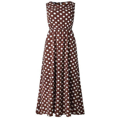 Brown dress with white polka dots shown flat from the front, with elasticated waist and flared skirt 1