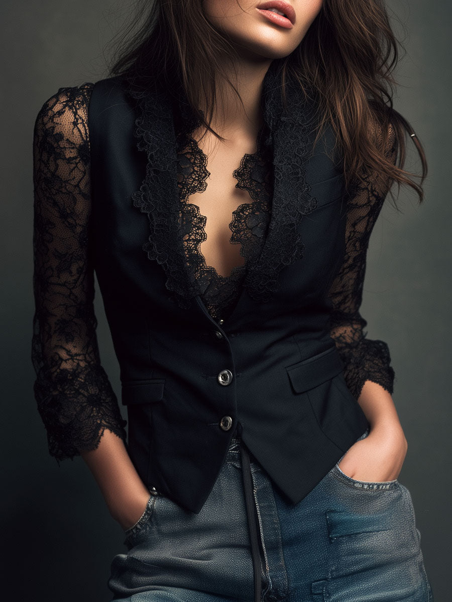 Model in black lace-sleeved waistcoat jacket with lace-edged lapels, hands in jeans pockets, studio shot 1