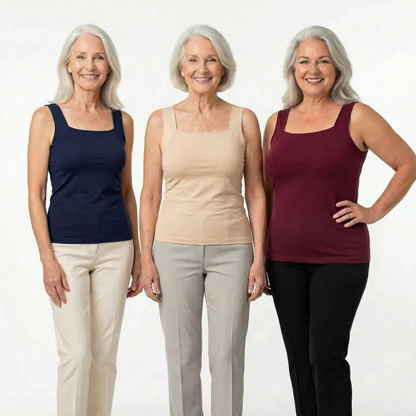 Three smiling women with grey hair stand together wearing square-neck sleeveless tops in navy, beige and burgundy with trousers. 10