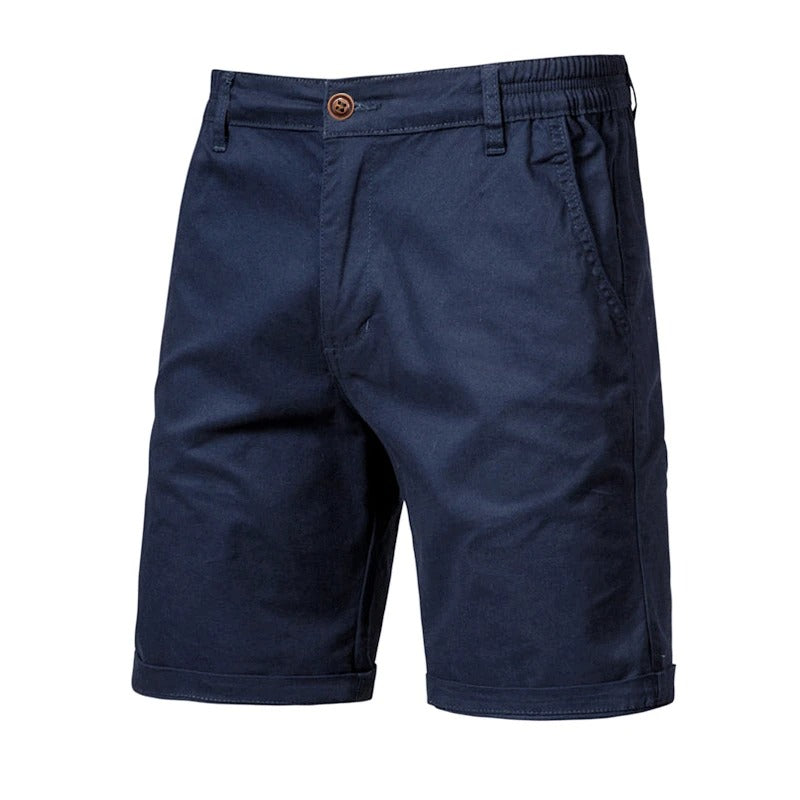 Front view of navy blue shorts with a brown button, elastic side waist and rolled hems 10