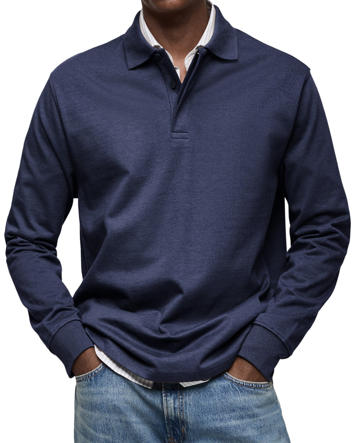 Navy version on a model, showing the ribbed cuffs and button placket over a striped shirt 3