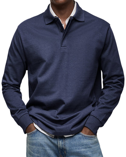 Navy version on a model, showing the ribbed cuffs and button placket over a striped shirt 3