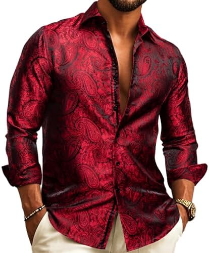 Model wearing the long-sleeve shirt in red and black paisley jacquard with a glossy finish, hands in trouser pockets. 9