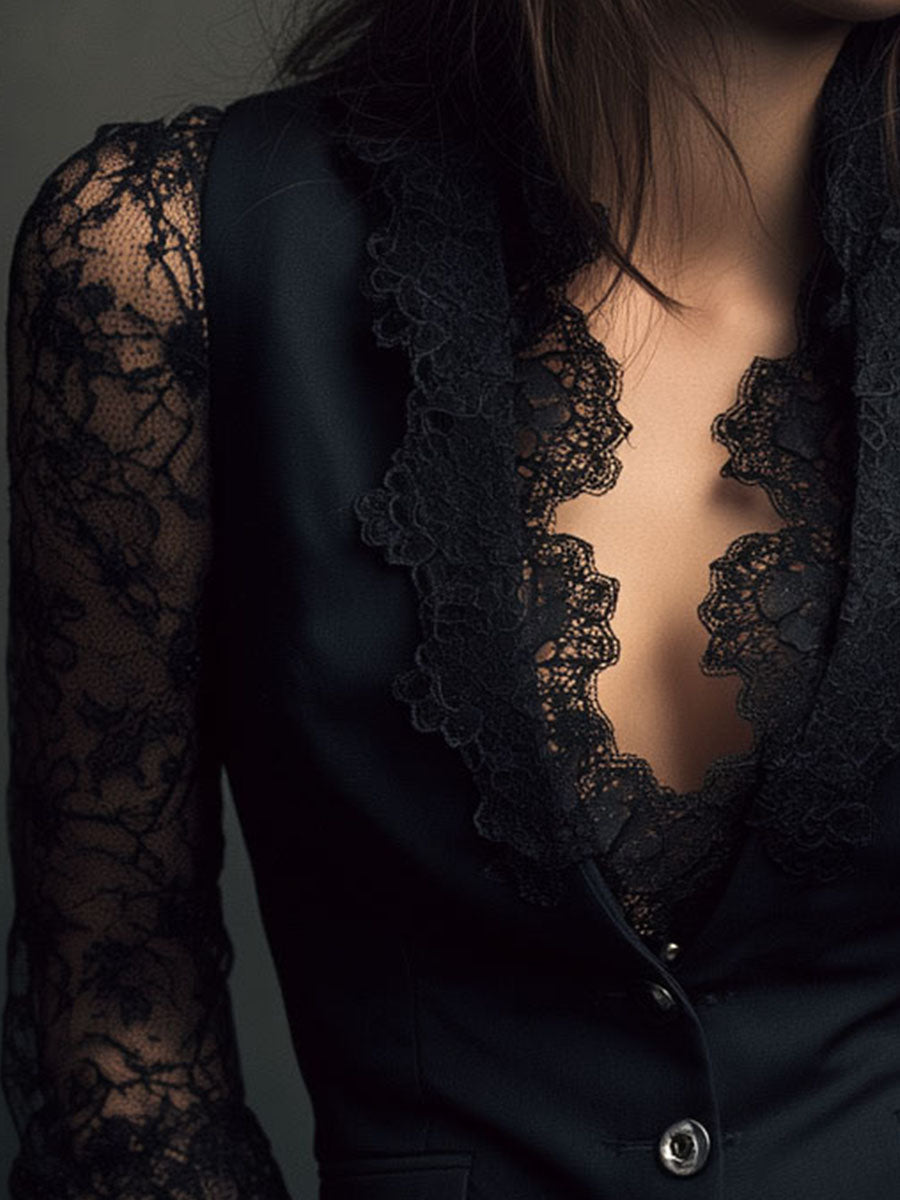 Close-up of the black lace-trimmed lapels, the plunging neckline and a sheer lace sleeve 17