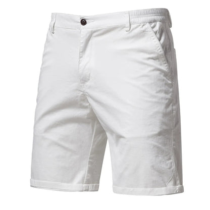Front view of white shorts with a dark button, slanted side pocket and rolled hems 9